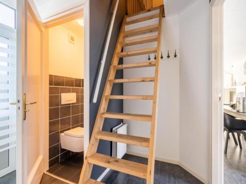 een ladder naar de badkamer in een tiny house bij Inviting holiday home in Baarland with terrace in Baarland