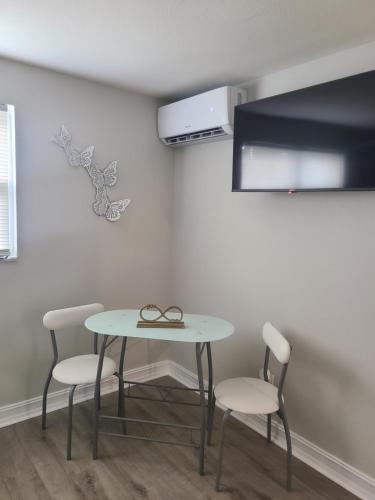 a table and two chairs in a room at Diamond 4 in Tampa