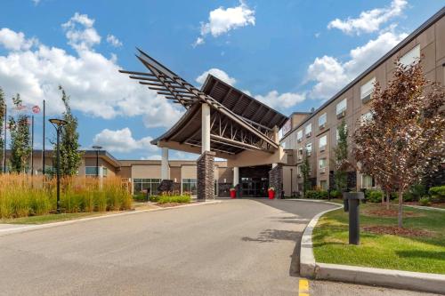 a building with a windmill on the side of it at Best Western Plus Edmonton Airport Hotel in Leduc