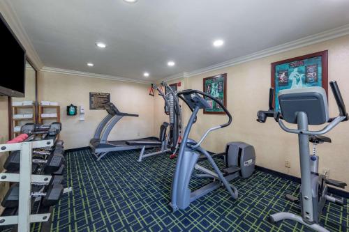 a fitness room with treadmills and cardio machines at Quality Inn Placentia Anaheim Fullerton in Placentia