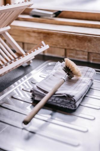 a brush sitting on top of a pile of towels at Hlid Cottages in Myvatn