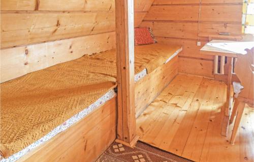 a wooden cabin with two bunk beds in it at Gorgeous Home In Mucharz With Sauna in Mucharz