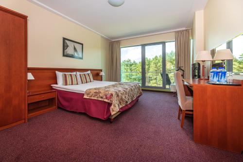 Postel nebo postele na pokoji v ubytování Meduza Hotel