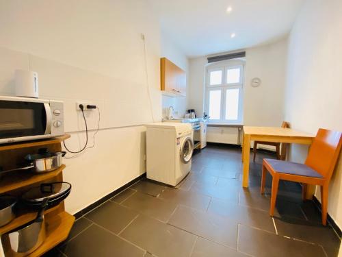 A cozinha ou cozinha compacta de BerlinLux Apartments - City