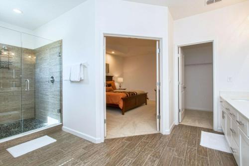 a bathroom with a shower and a bedroom at Sonoma Resort 7 Bedroom Vacation Home 2600YA in Kissimmee