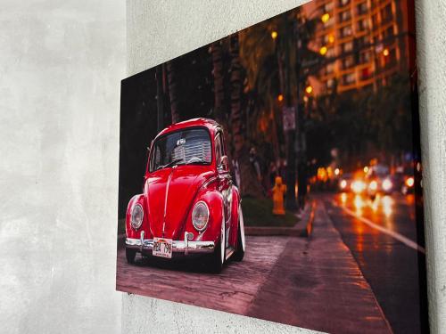 a painting of a red car on the side of a street at Geroweiher Monteurzimmer Mönchengladbach Stadtmitte in Mönchengladbach