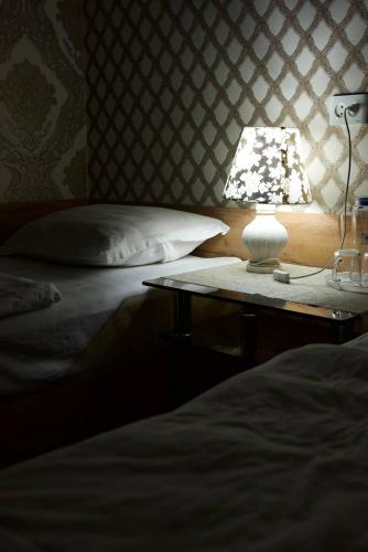 Ένα ή περισσότερα κρεβάτια σε δωμάτιο στο DAVAN Hotel