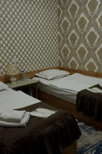 Ένα ή περισσότερα κρεβάτια σε δωμάτιο στο DAVAN Hotel