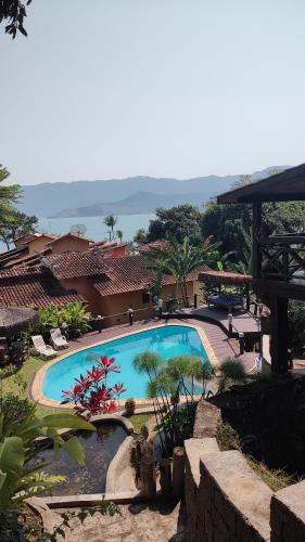 a view of a swimming pool in a resort at Cantinho Alentejano in Ilhabela