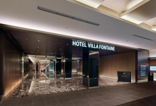 a hotel lobby with a hotel vaultulture sign at Villa Fontaine Grand Haneda Airport in Tokyo