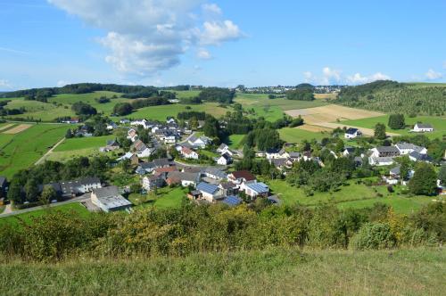 a small village in a green field with houses at Ferienwohnung Lampertstal in Alendorf, Toskana der Eifel in Blankenheim