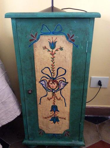 a green cabinet with a painting on it at Villa Floresta Taormina in Taormina