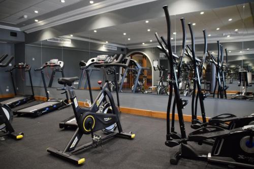 a gym with a bunch of exercise bikes in it at Paradise Bay Resort in Mellieħa