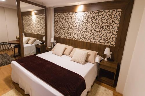 Postel nebo postele na pokoji v ubytování JR Hotel Ribeirão Preto