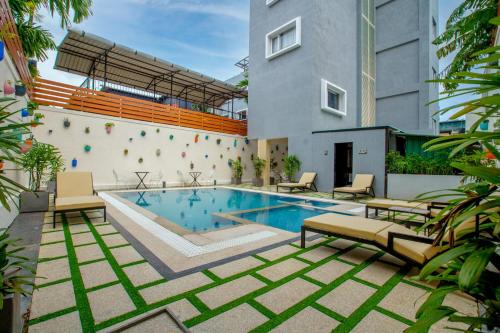 a swimming pool in the middle of a building at Eastern Gate - A Bergamont Group of Hotel in Port Blair