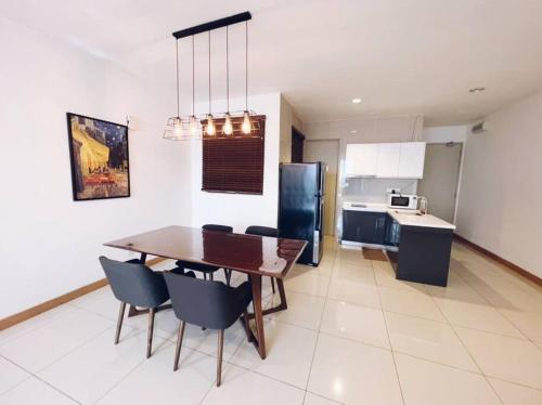 a kitchen and dining room with a table and chairs at [PROMO]Connected train 2 Bedrooms - Above Mall(25) in Kuala Lumpur