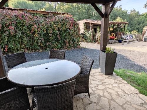 a table and chairs sitting on a patio at Pagel in Catus