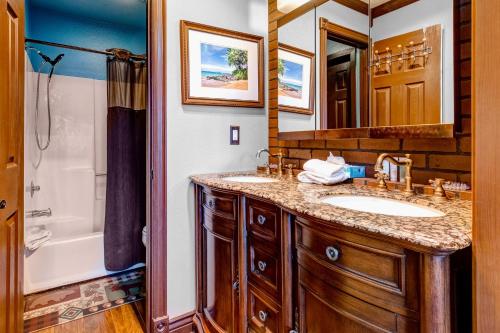 a bathroom with two sinks and a shower at Red Pine Q8 in Park City