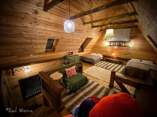 a view of a living room in a log cabin at Breb s Cosy Barn in Breb
