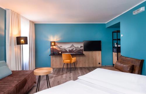 Ένα ή περισσότερα κρεβάτια σε δωμάτιο στο Mercure Hotel München Neuperlach Süd