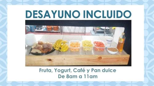 a sign that reads dysko inducha with a tray of food at HOTEL BLUE in Puerto Vallarta