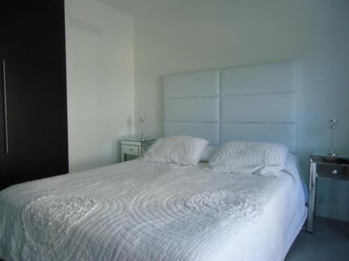 Кровать или кровати в номере Yoo Deluxe Apartamento