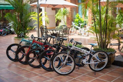 a group of bikes parked next to each other at Mali Namphu Hotel in Vientiane