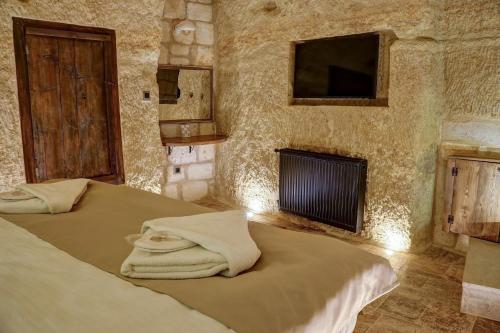 Katil atau katil-katil dalam bilik di Dionysos Cave Cappadocia Hotel