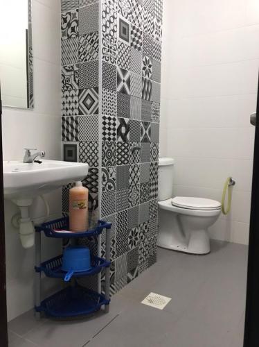 a bathroom with a sink and a toilet at MMG D'Bertam Homestay For Malay Only in Kampong Permatang Durian