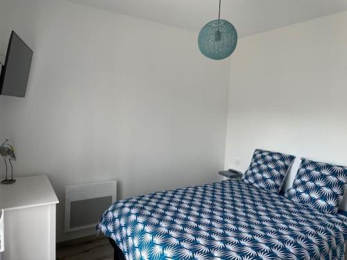 Postel nebo postele na pokoji v ubytování Gîte Le petit quartier