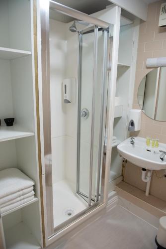 a bathroom with a shower and a sink at Leevin Stay Apartments City Center in Dublin
