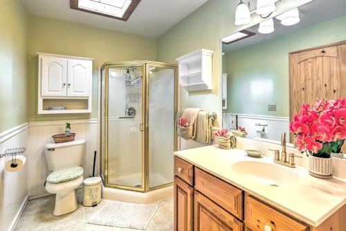 a bathroom with a shower and a sink and a toilet at Château Forêt with Hiking Trail Access Nearby in Big Bear City