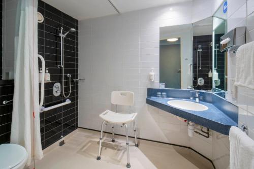 a bathroom with a sink and a toilet at Holiday Inn Express York, an IHG Hotel in York