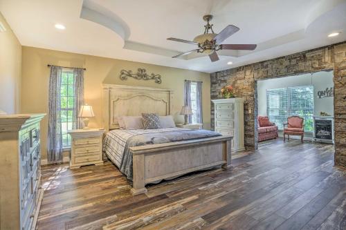 a bedroom with a bed and a ceiling fan at Spacious Group-Friendly Georgia Home on Lake in Trenton