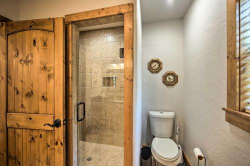 a bathroom with a toilet and a shower at The Bird Cabin Peaceful Refuge in East Texas in Ben Wheeler