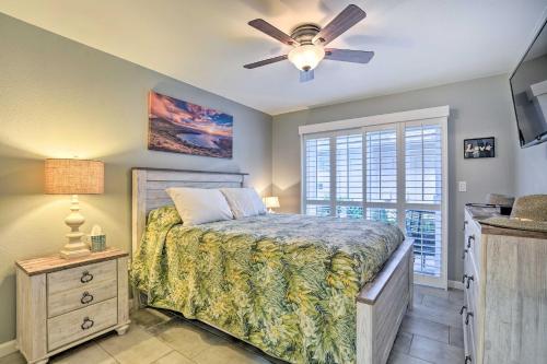 a bedroom with a bed and a ceiling fan at Coastal Ko Olina Townhome - Walk to Beaches! in Kapolei