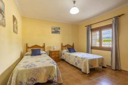 Postel nebo postele na pokoji v ubytování Finca Can Tomeu