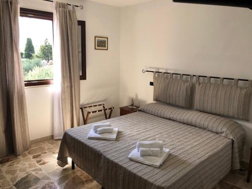 Ένα ή περισσότερα κρεβάτια σε δωμάτιο στο U Puzzo Ranne