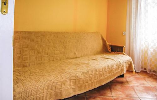 a couch sitting in the corner of a room at Beautiful Home In Cekcyn With 2 Bedrooms in Cekcyn