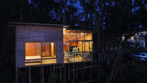 a small house is lit up at night at Luxury Tiny House - Minca in Minca