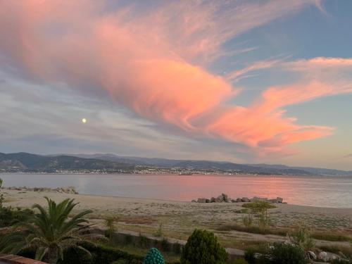 a view of a beach with a cloudy sky at Casa Azzurra in Messina