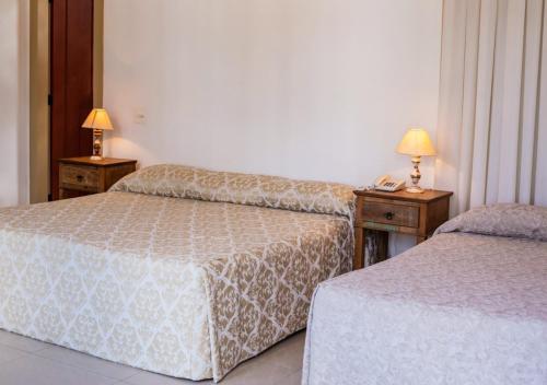 Katil atau katil-katil dalam bilik di Ville Real Hotel