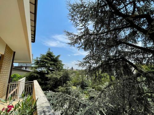 a view from the balcony of a house with trees at Angela Home in Rimini