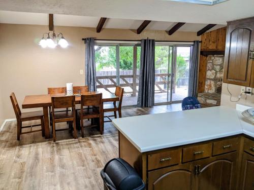 a kitchen and dining room with a table and chairs at Mountain Views Near Sedona with Fenced Backyard in Cottonwood