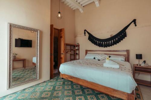 Postel nebo postele na pokoji v ubytování Hotel Casa Piedad