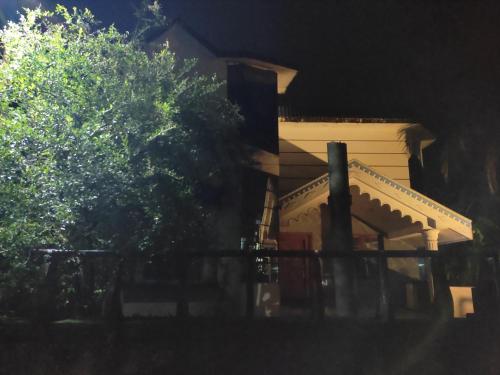 a house with a fence in front of it at Gruham Malpe Homestay Udupi in Malpe