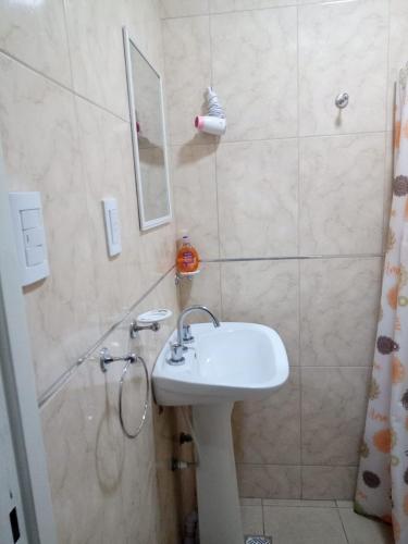 a bathroom with a sink and a shower at San Rafael Ciudad in San Rafael