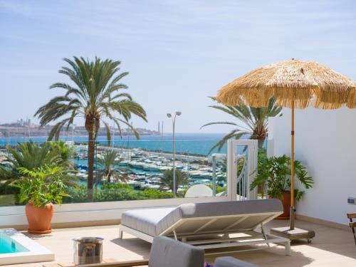 a resort with a view of the ocean and a beach at Pasitoblanco Porto Mare 44 Seaview Villa private heated pool in Pasito Blanco