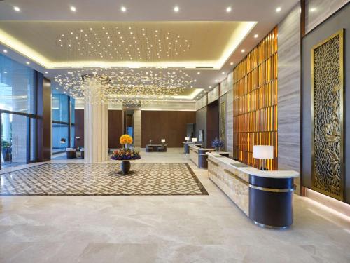 a lobby of a hotel with a reception desk at Radisson Blu Resort Phu Quoc in Phú Quốc