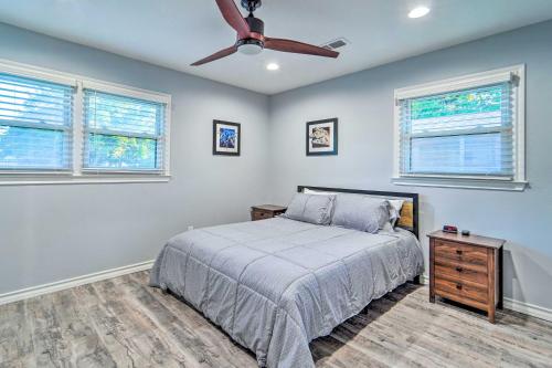 a bedroom with a bed and a ceiling fan at Lovely Lubbock Home with Furnished Patio and Yard in Lubbock